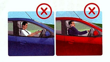 運転中は、携帯電話を手に持って使用してはなりません。